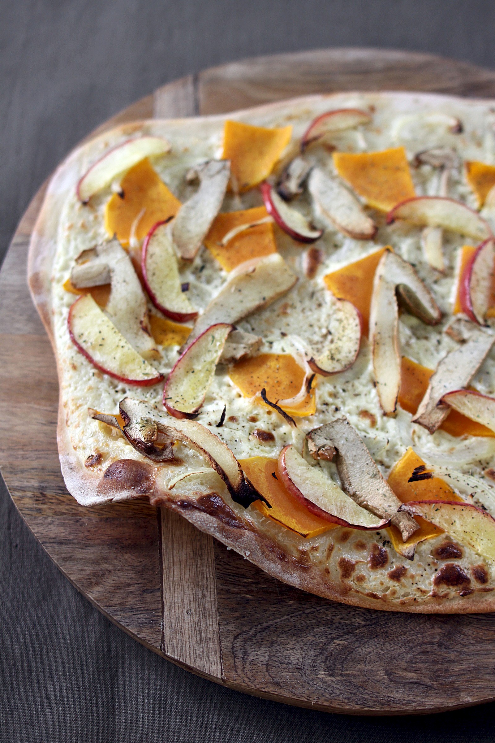 Tarte flambée with porcini mushrooms, pumpkin and apple