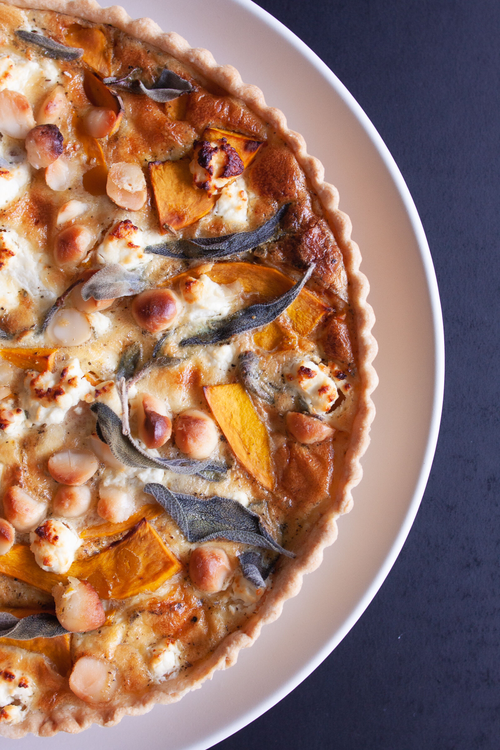 Hokkaido quiche with goat cheese, macadamia and sage