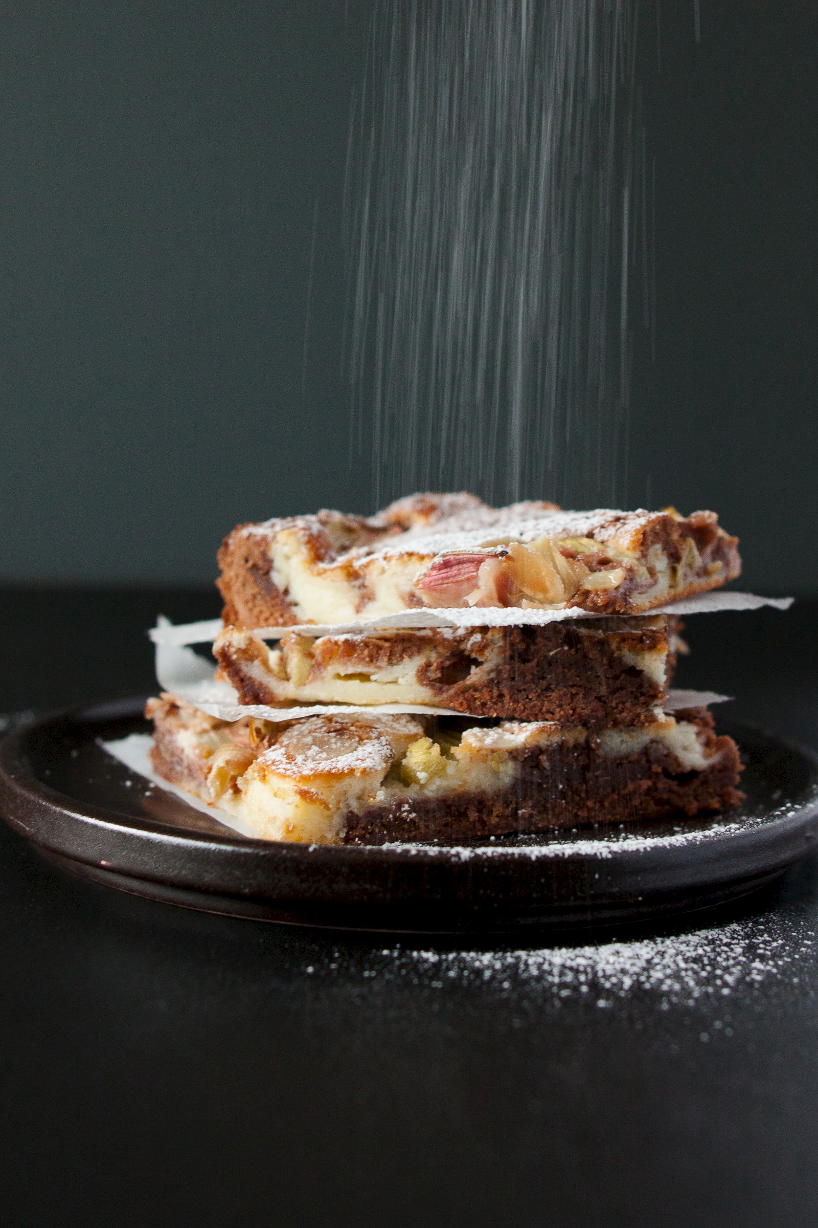 Brownie cheesecake with rhubarb and almonds