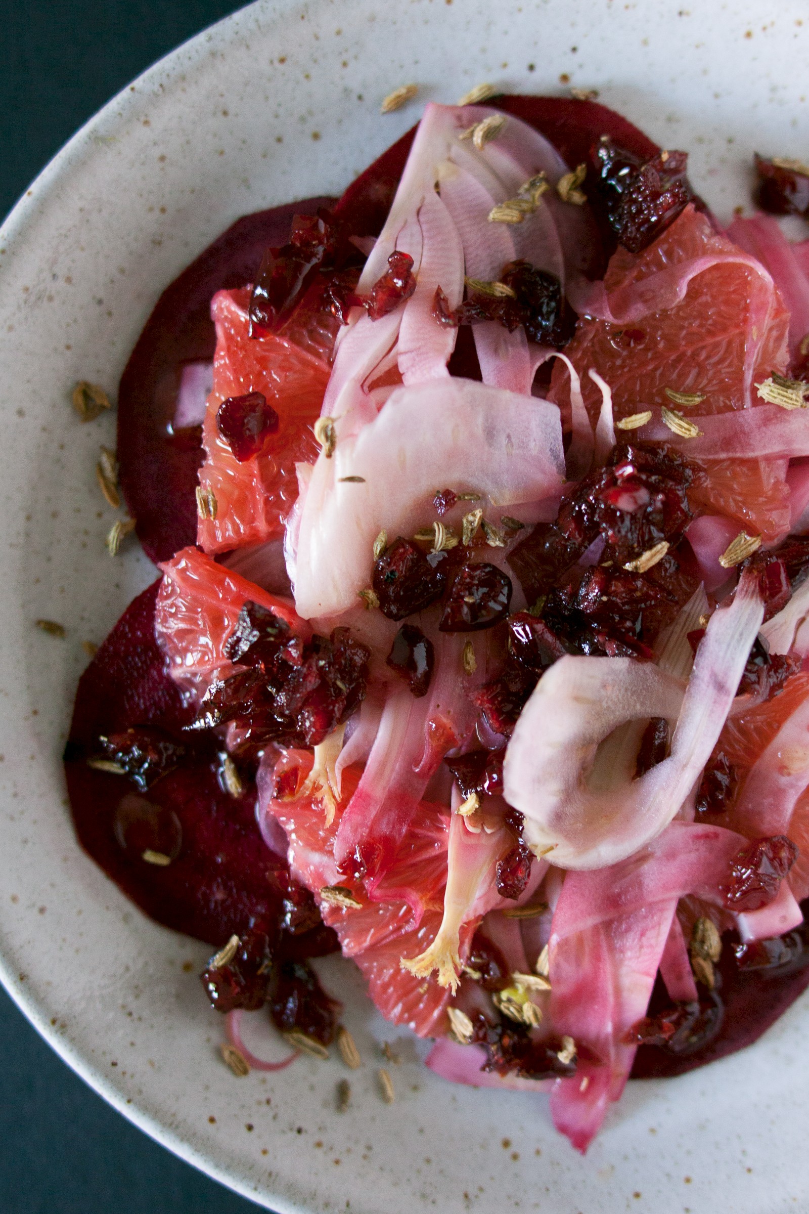 Pink salad with cranberry dressing and caramelised fennel seeds