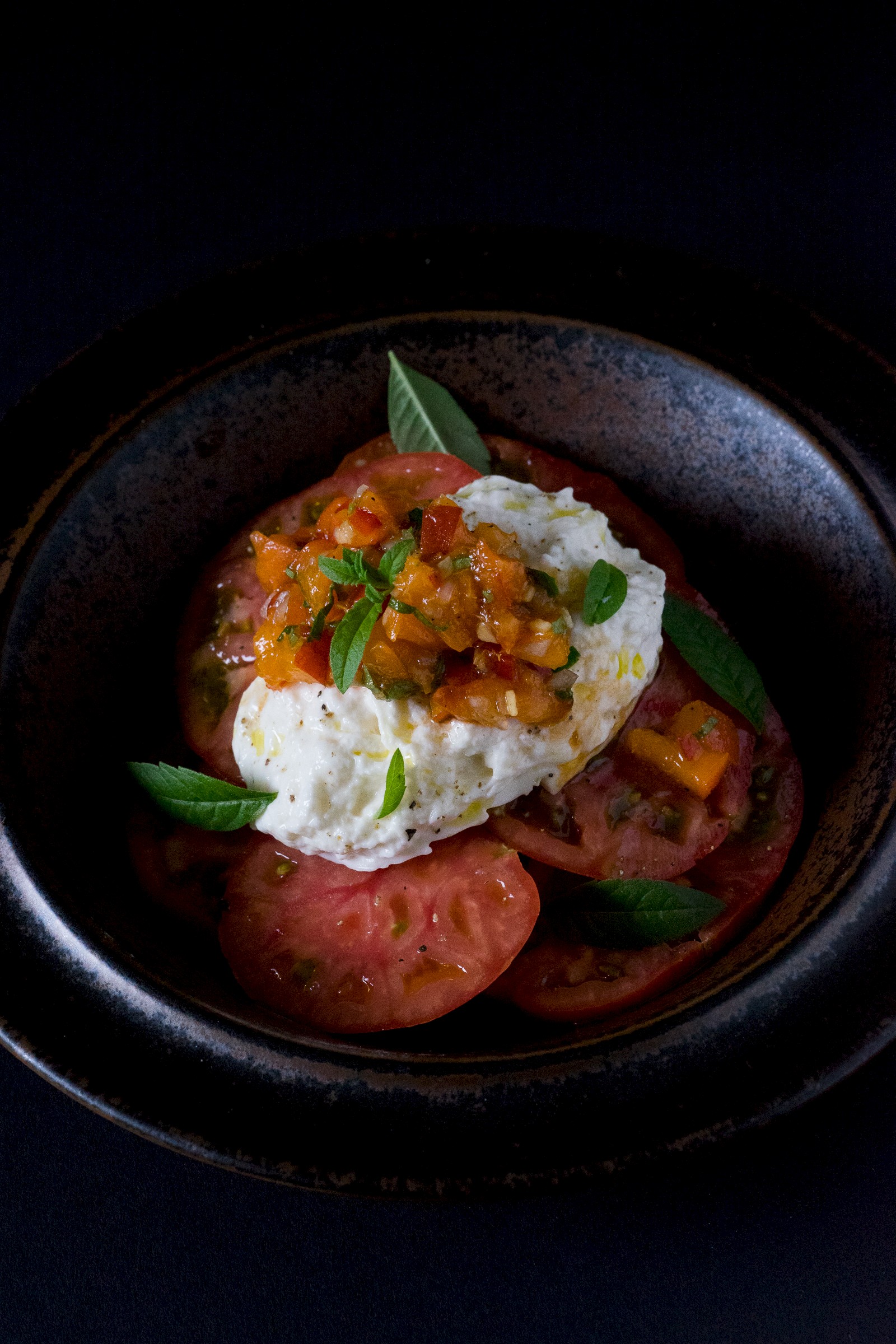 Tomatoes and burrata cheese with apricot and verbena salsa