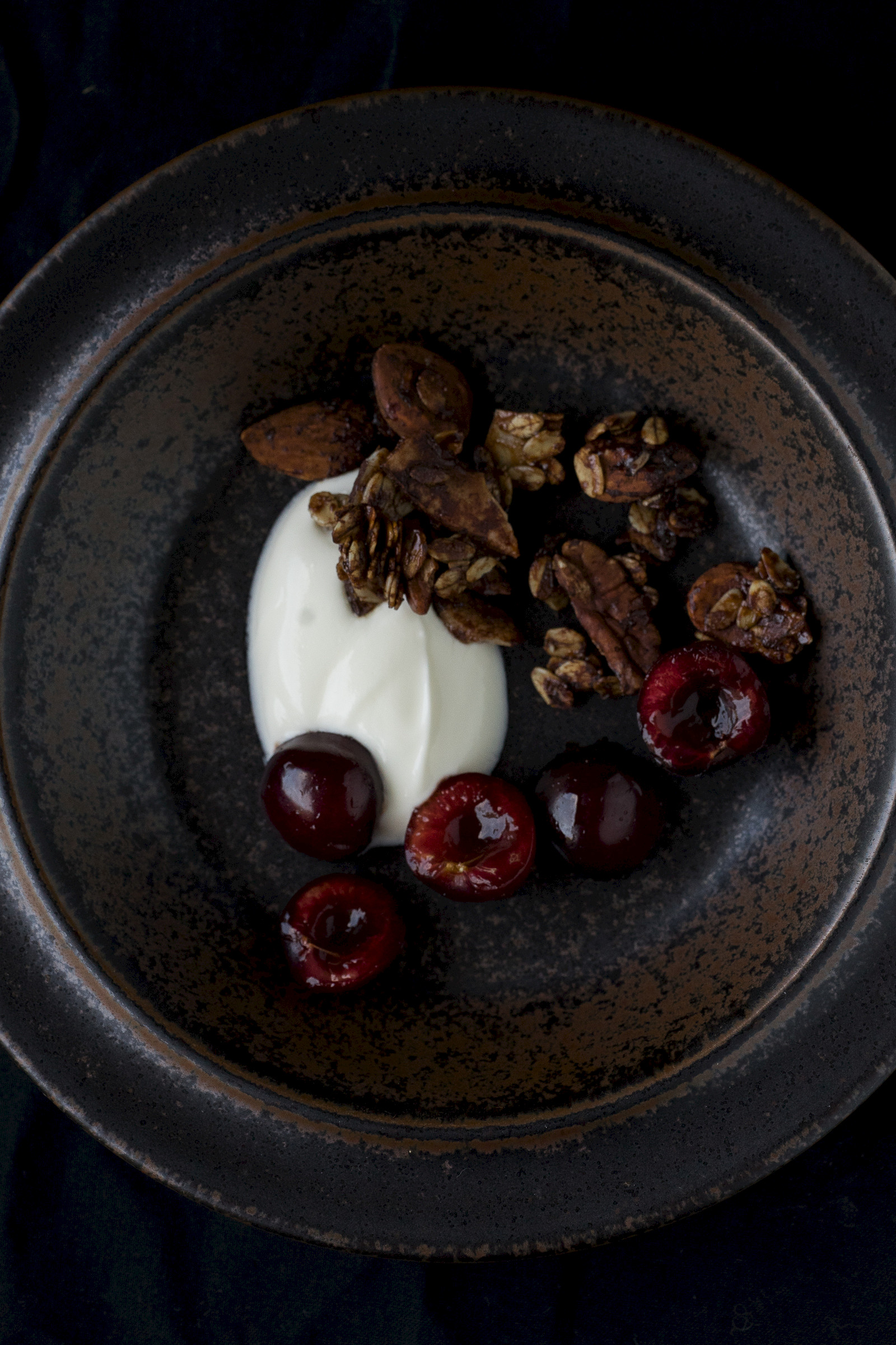 Chocolate granola with cherries and greek yogurt
