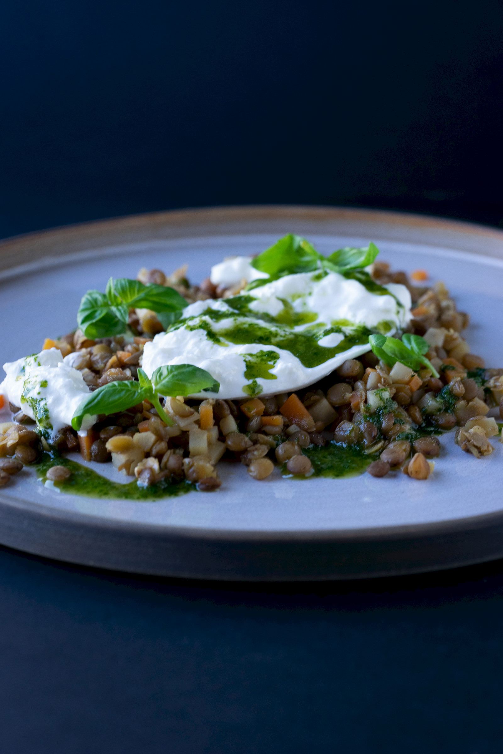 Lentil salad with burrata and basil oil