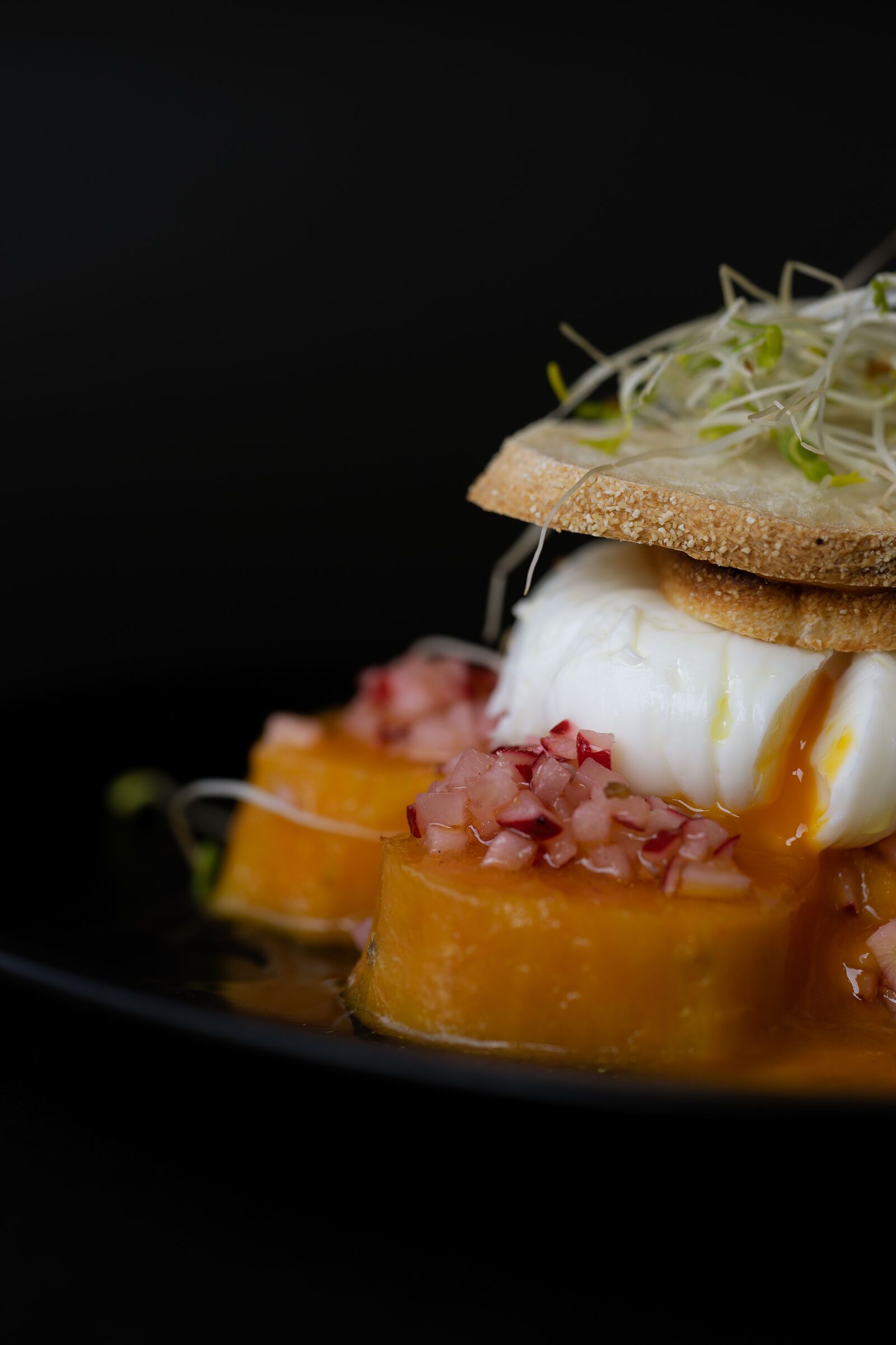Sweet potatoes with poached egg and red radish dressing