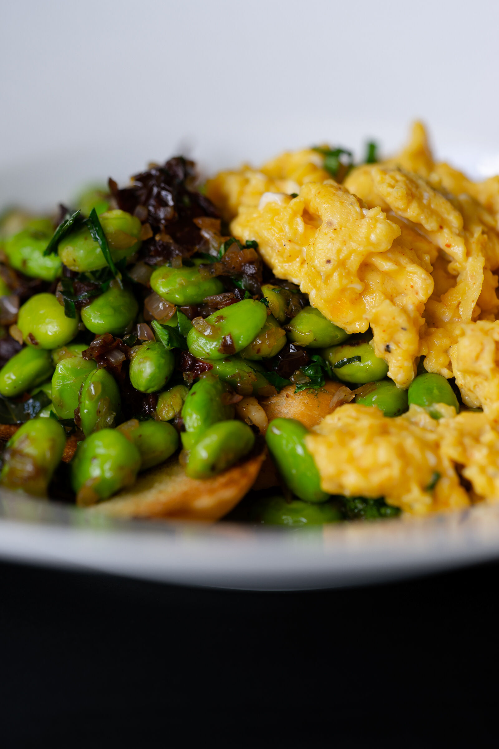 Scrambled eggs with edamame and dried tomatoes