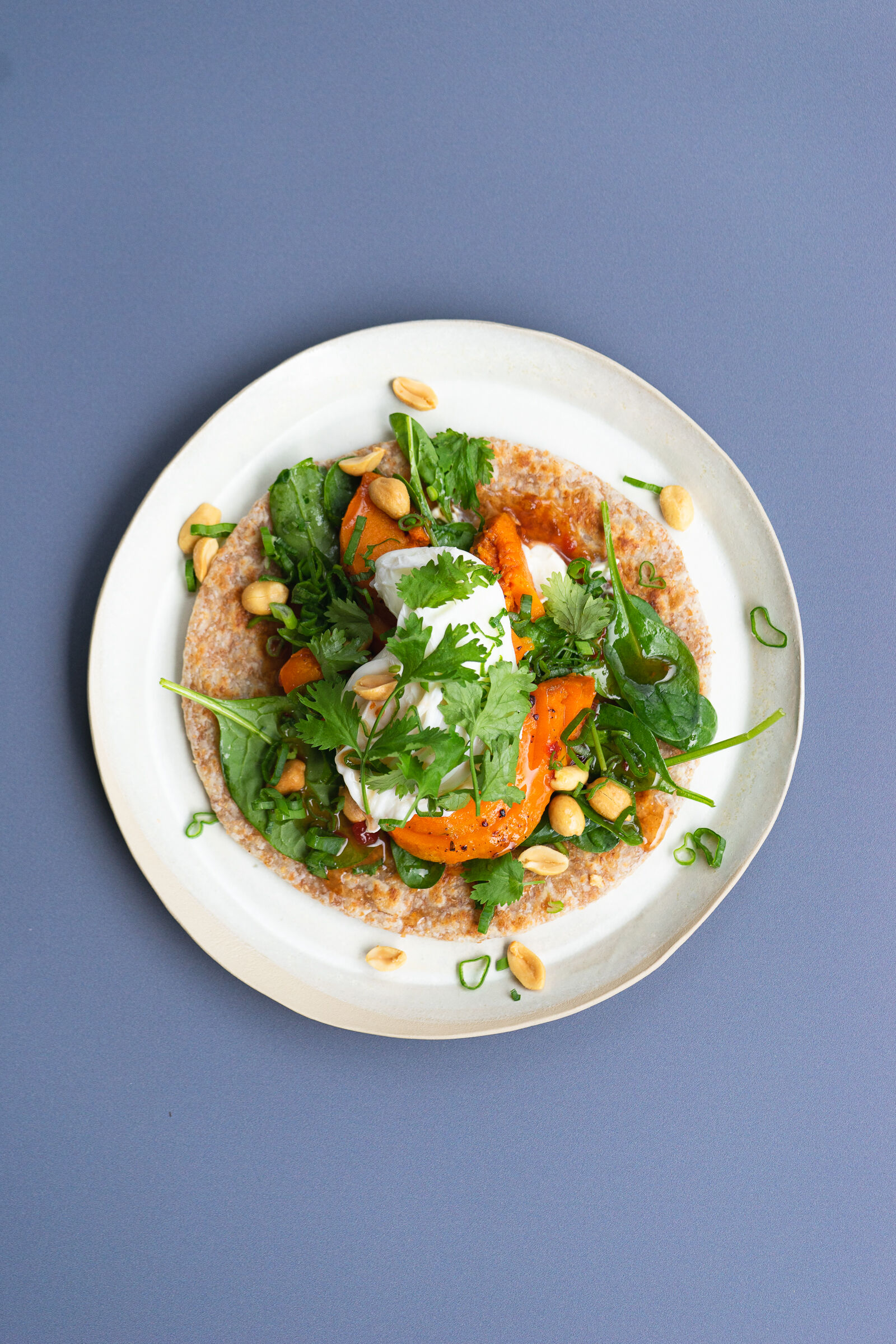 Roti with pumpkin, spinach, egg and chilli sauce